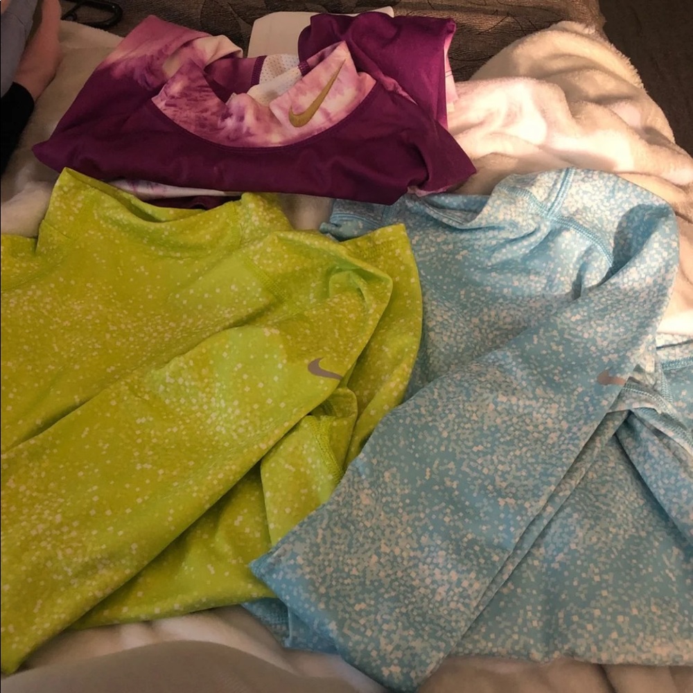 Three longsleeve Nike shirts for girls